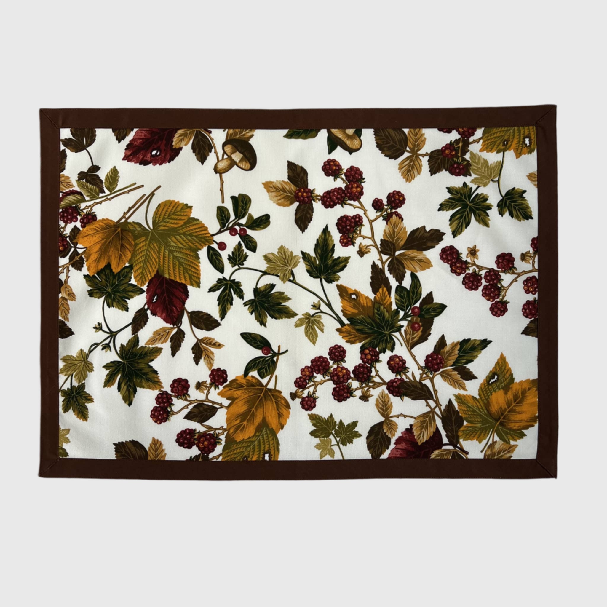 Placemat with autumn leaf and berry pattern