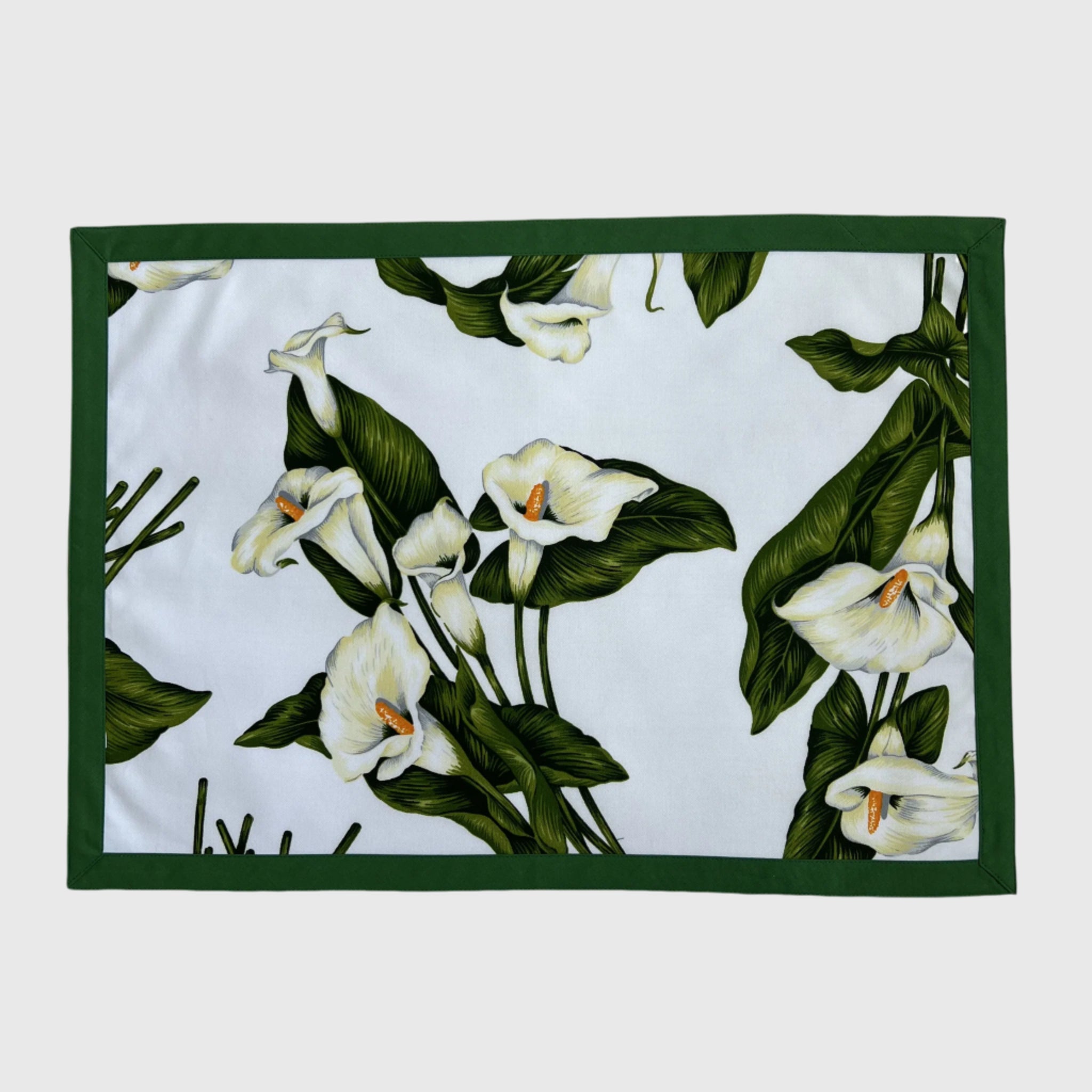 Placemat with white floral and green plant design