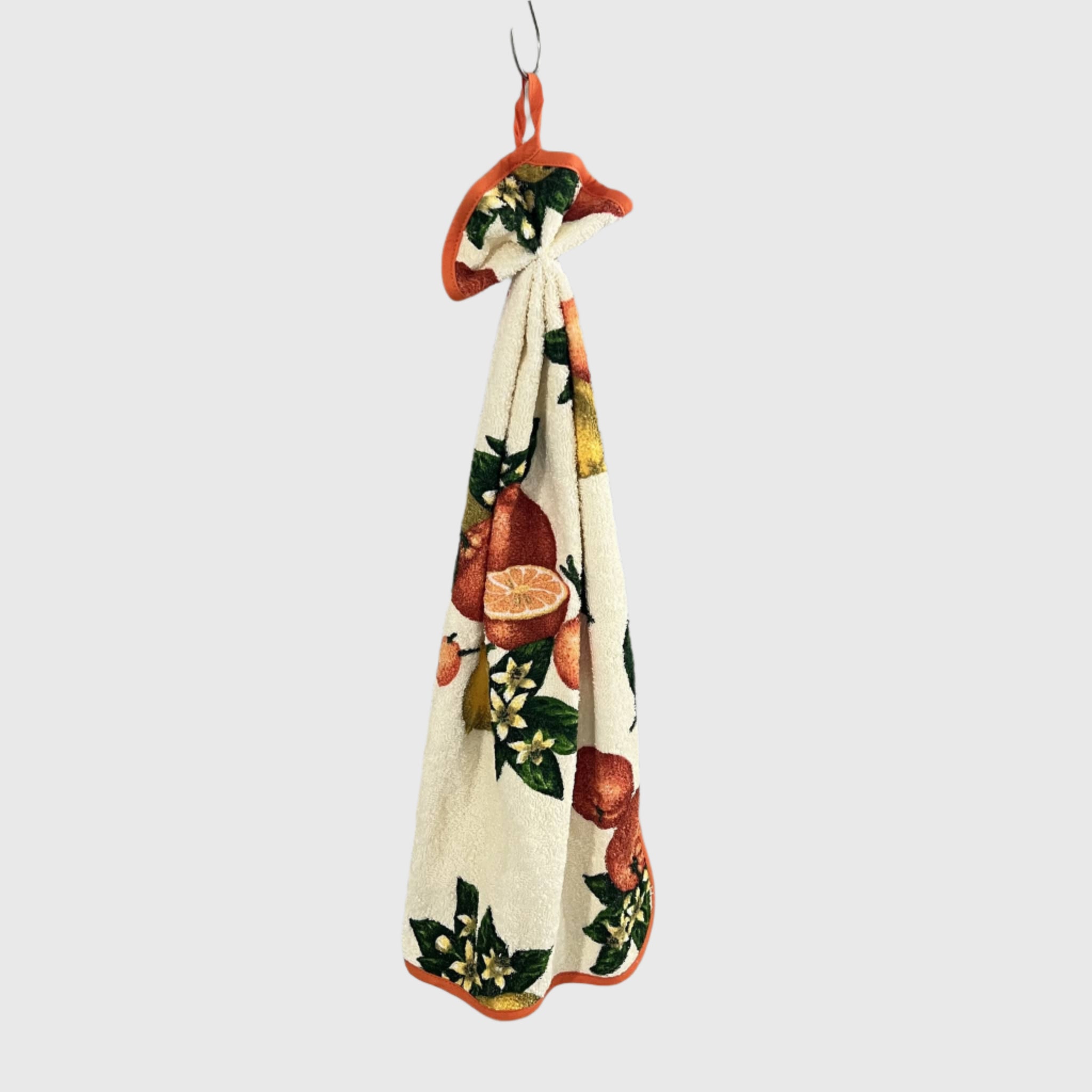 Curled towel with orange fruit pattern