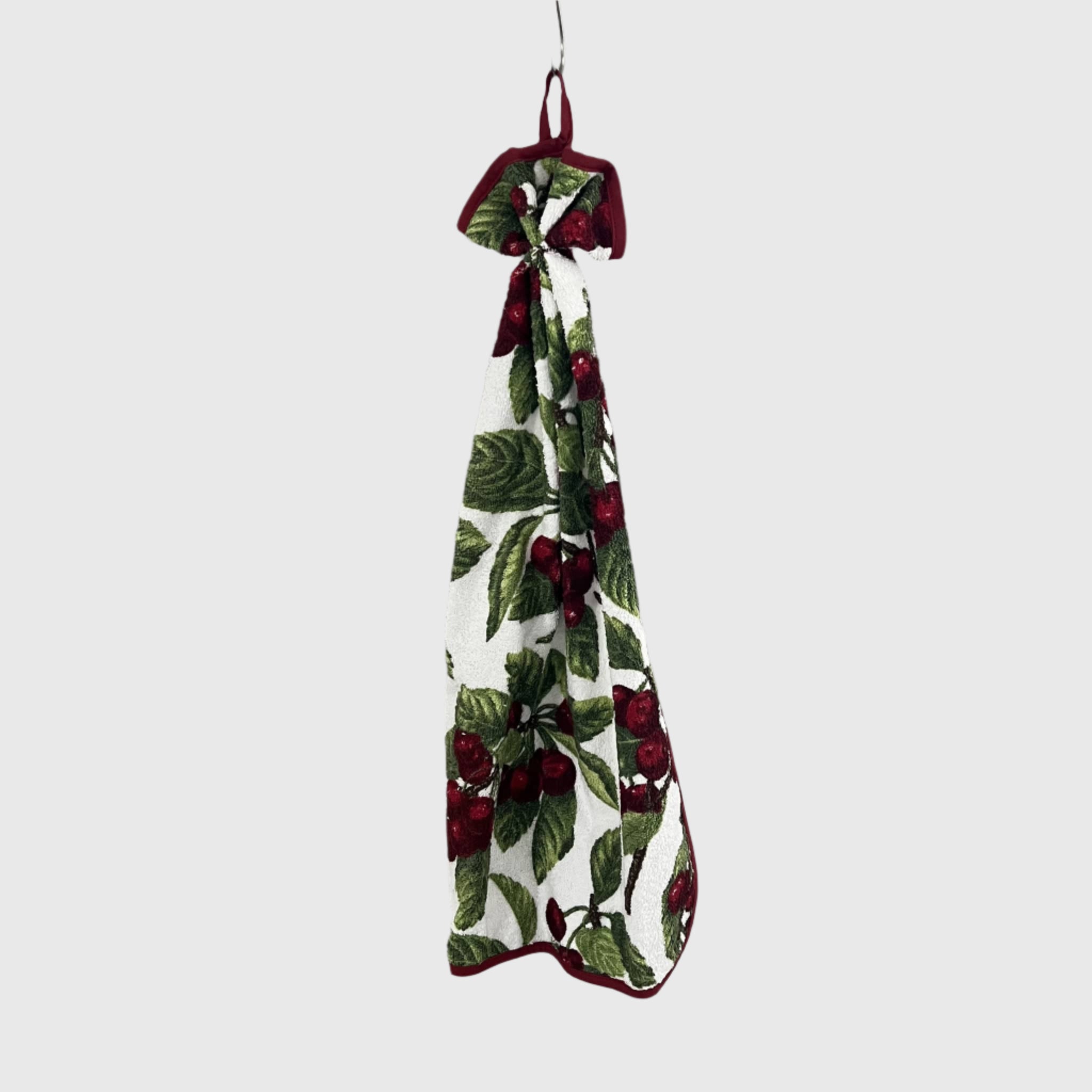 Curled towel with red cherries pattern