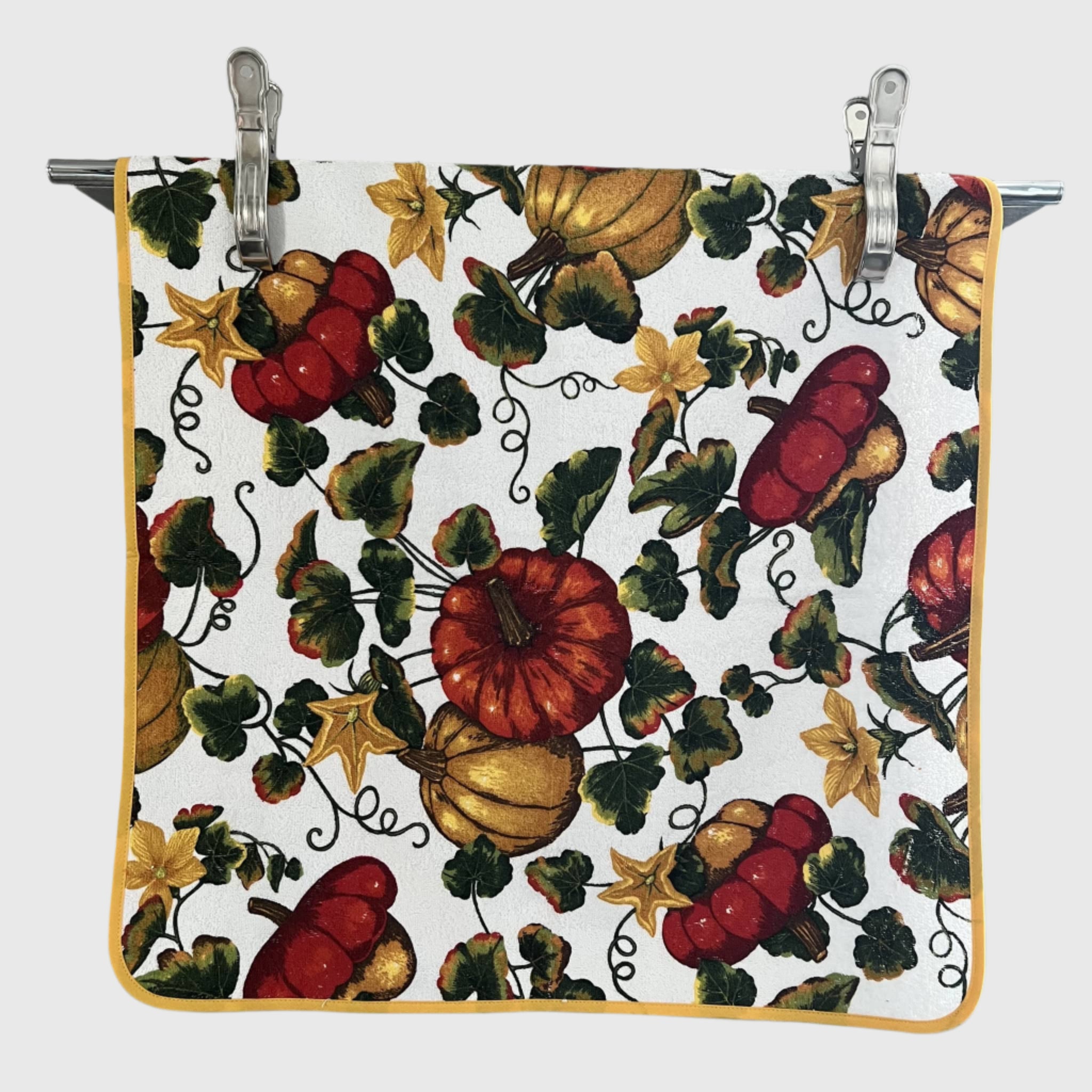 Square towel with autumn leaf pattern featuring pumpkins